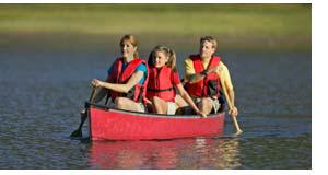 Family Enjoying A Day Canoeing